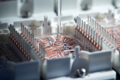Danfoss Silicon Power manufacturing process of a power module showing addition of silicon paste