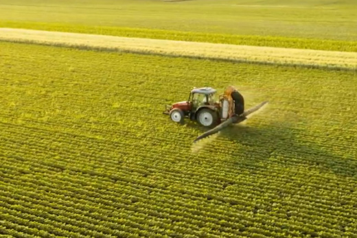 Transforming lives for farmers - Tractor on field I Danfoss