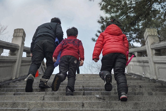 Family walking up the stairs in Benxi