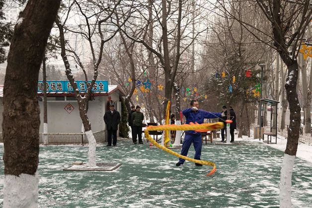 Man dancing in square, Benxi