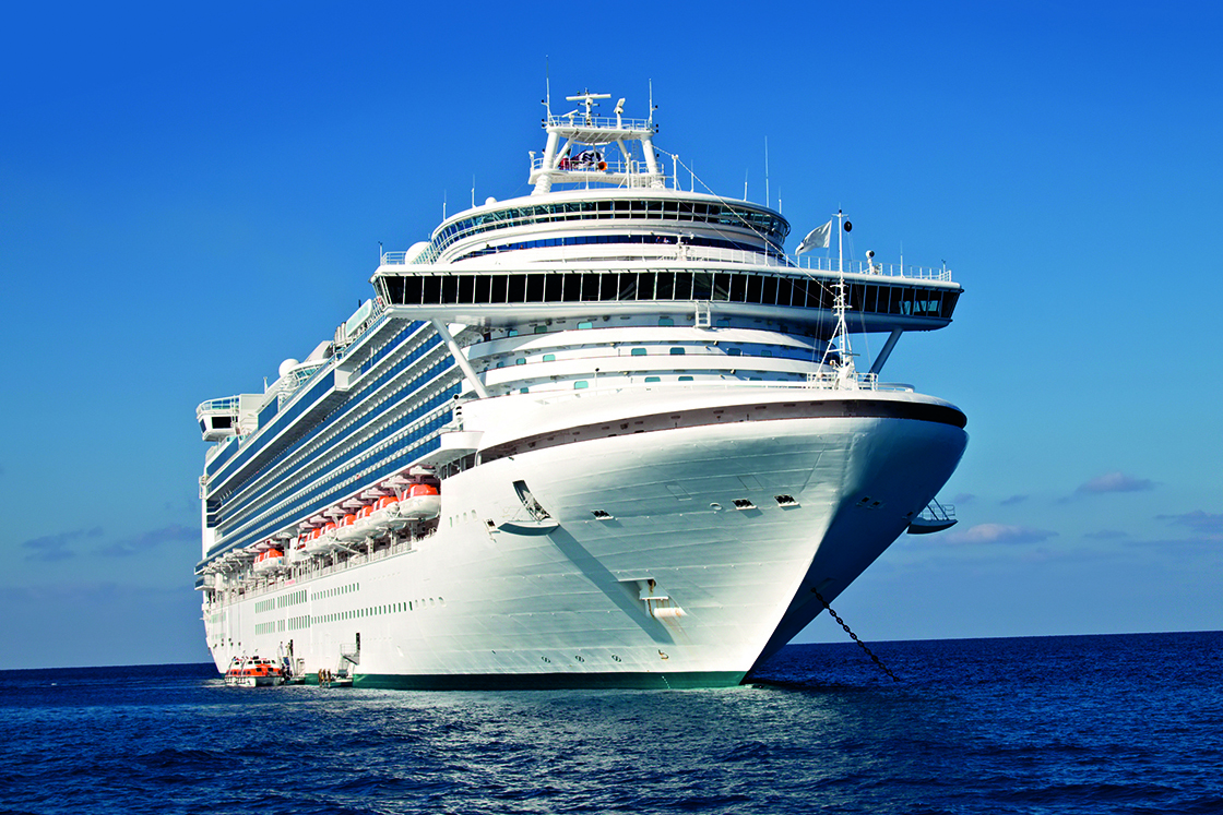 A big white cruise ship out on the open water