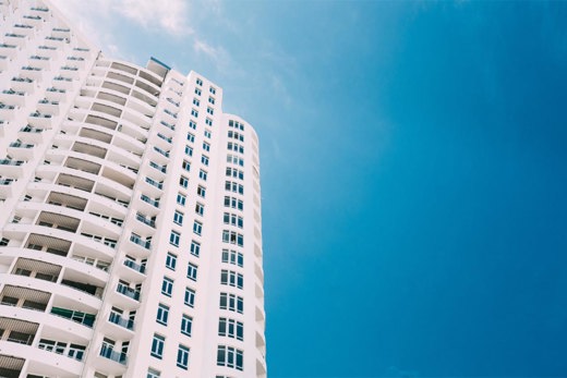 high rise building overlooked the sky