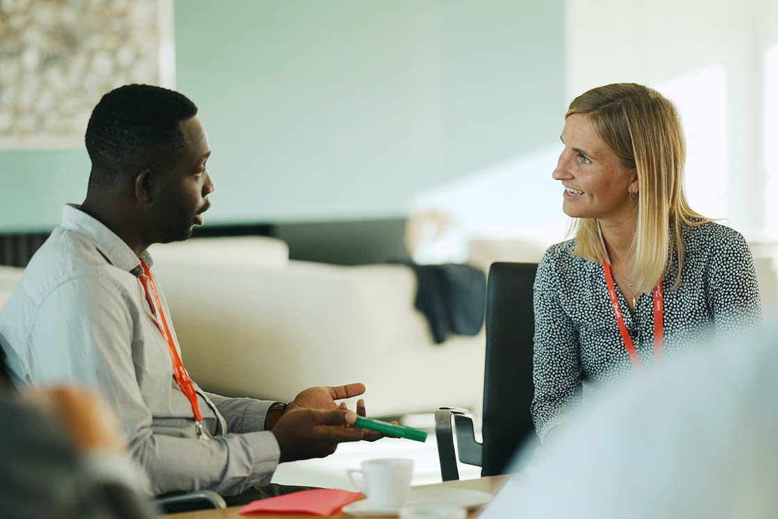 Diversity - two young Danfoss employees talking