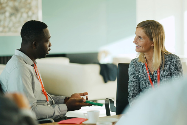 Diversity - two young Danfoss employees talking