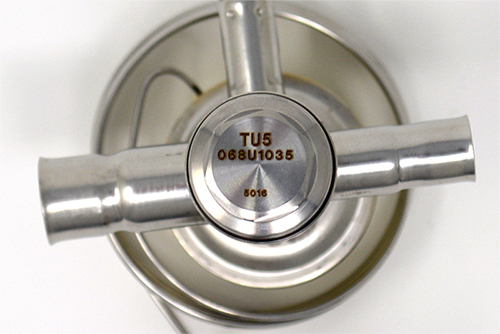 A look at the bottom of a thermostatic expansion valve to display the orifice type