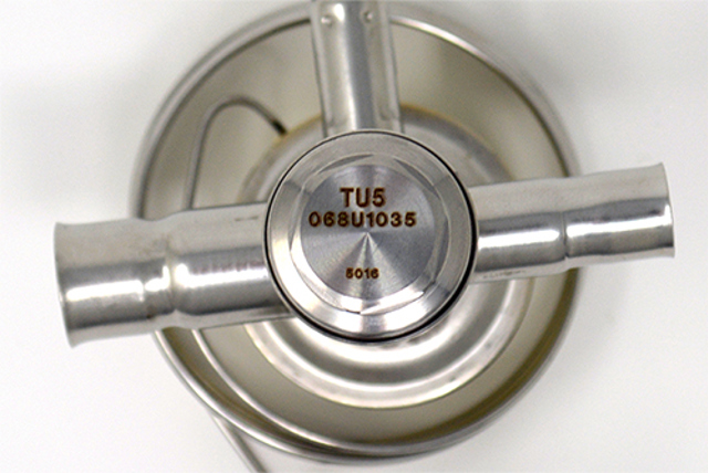 A look at the bottom of a thermostatic expansion valve to display the orifice type