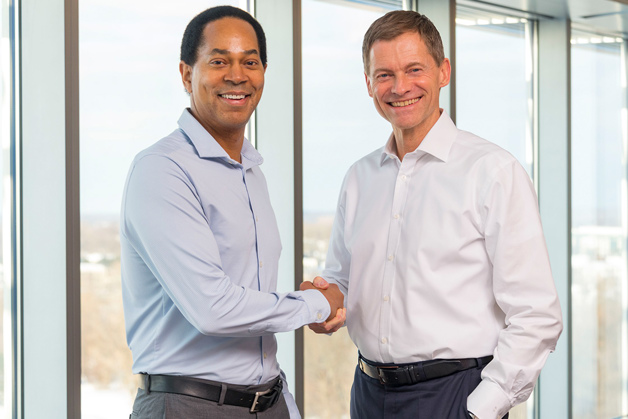 Handshake between Eaton Chairman and CEO, Craig Arnold and CEO, Kim Fausing