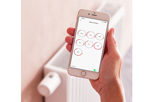 Danfoss App mit Radiator im Hintergrund