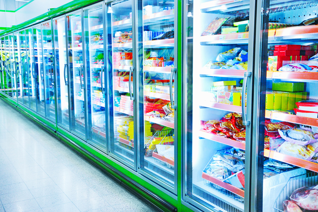 An extremely overused photo of display cases in a supermarket in strange neon colors
