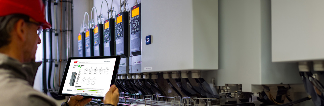 Person gathering spare parts at a Danfoss factory