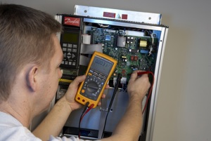 Man troubleshooting an AC drive