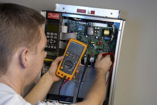 Man troubleshooting an AC drive