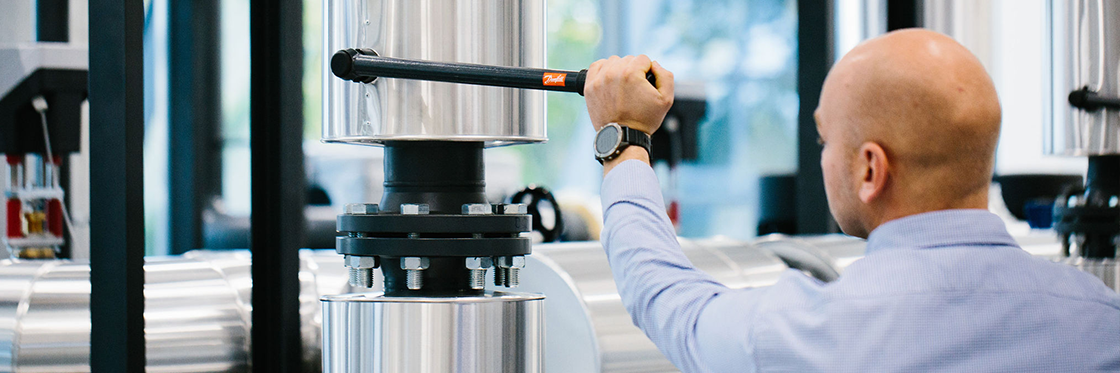 Man working with Danfoss heating system  