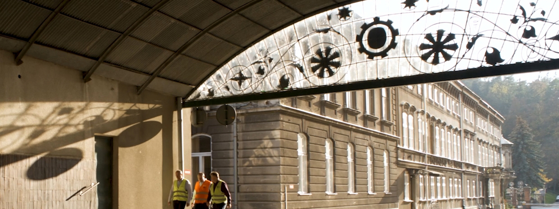 3 men walking at Carlsberg's Okocim Brewery