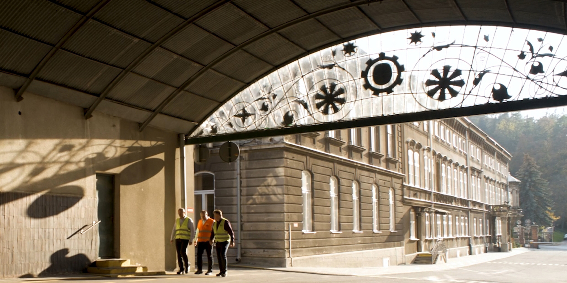 3 men walking at Carlsberg's Okocim Brewery