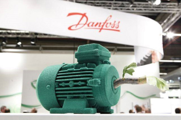 Green motor in front of a Danfoss logo