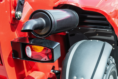 The brake light on large, red farming/construction machine representing Danfoss hydraulic sensors for brake lights