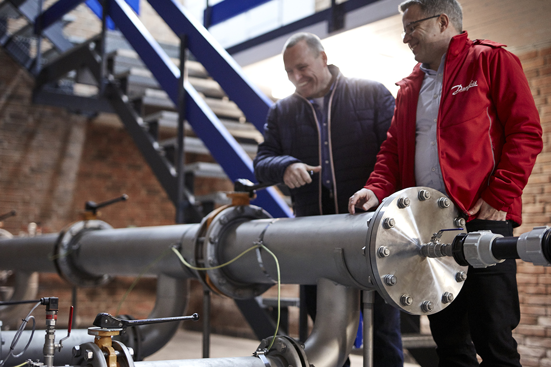 A Danfoss employee helping a water treatment plant manager
