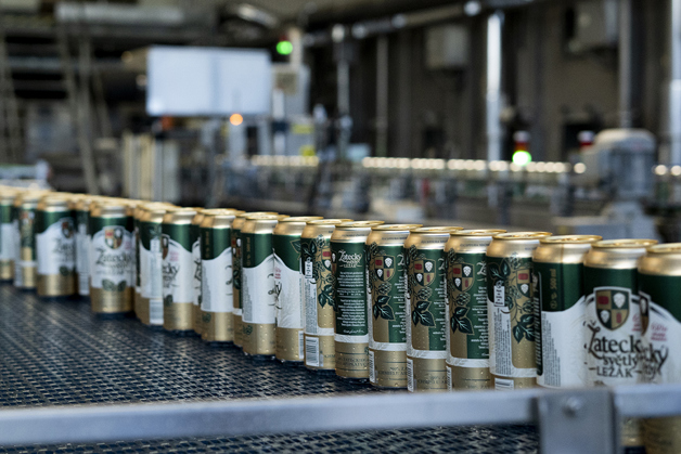 Close-up of beer cans on a bottling line