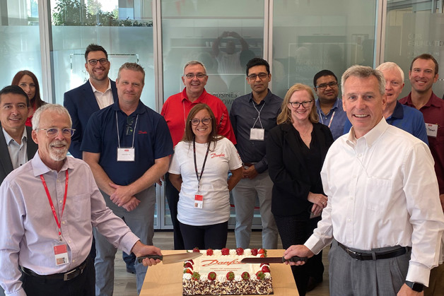 Rick Sporrer and the Danfoss Canada team celebrate with cake