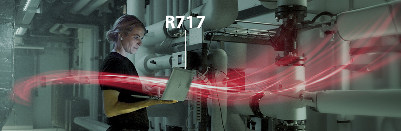 woman holding a laptop with red network visualization