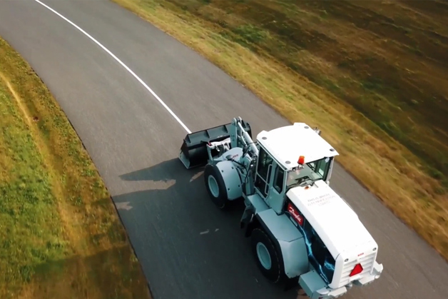 Bird's eye view of a tractor driving along the road