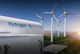 Depósito de hidrógeno con aerogeneradores y paneles solares en segundo plano
