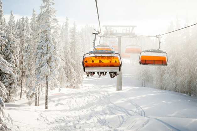 Skiers sitting in a chairlift
