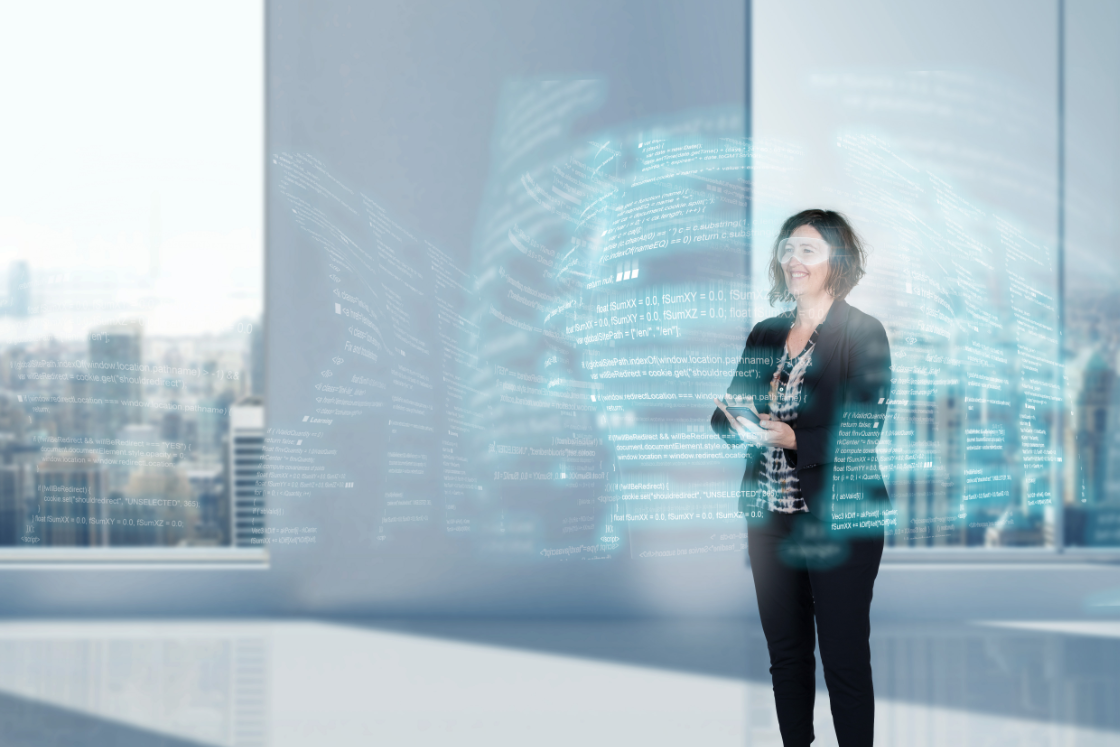 A woman who stands and work on software code