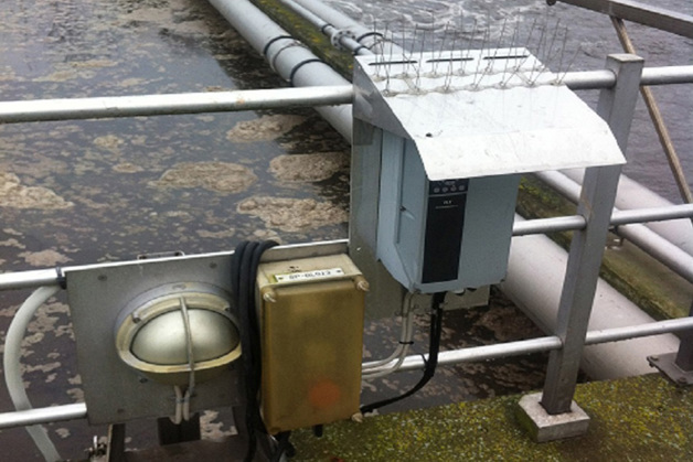 AC Drive placed outside by a pond covered by a SunShield